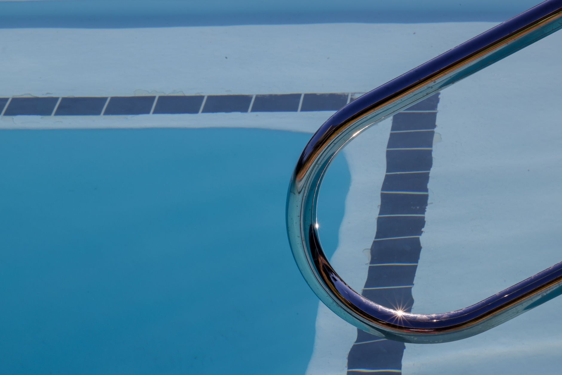 A sparkling saltwater pool with visible waterline scale in Yuma, Arizona