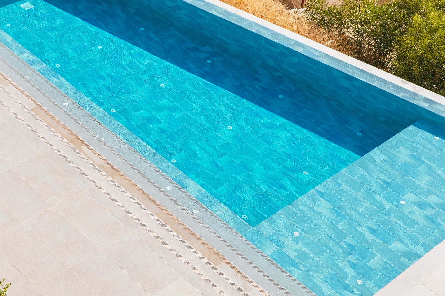 A clean, sparkling backyard swimming pool at a home for sale in Yuma, Arizona